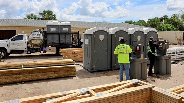 Luxe Flush porta potties and hand wash stations on an Orange County construction site